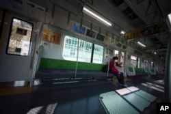 A man with protective mask rides an empty train Wednesday, April 8, 2020, in Tokyo. Japanese Prime Minister Shinzo Abe declared a state of emergency yesterday for Tokyo and six other prefectures. (AP)