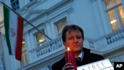 FILE - Richard Ratcliffe, husband of imprisoned charity worker Nazanin Zaghari-Ratcliffe, poses for the media during an Amnesty International led vigil outside the Iranian Embassy in London, Jan. 16, 2017.