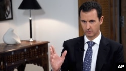 바샤르 알 아사드 시리아 대통령이 11일 다마스쿠스에서 스페인 EFE 통신과 인터뷰하고 있다.