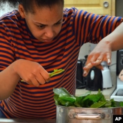 Developmentally-disabled residents of group homes in Maryland help prepare the fresh vegetables - from Red Wiggler Farm - for dinner.