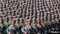 Soldiers of China's People's Liberation Army (PLA) get ready for the military parade to commemorate the 90th anniversary of the foundation of the army at Zhurihe military training base in Inner Mongolia Autonomous Region, China, July 30, 2017.