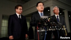 South Korea's National Security Office head Chung Eui-yong, center, Cho Yoon-je, the South Korean Ambassador to the U.S., right, and National Intelligence Service chief Suh Hoon, left, make an announcement about North Korea and the Trump administration outside of the West Wing at the White House in Washington, March 8, 2018.
