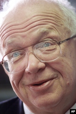 FILE - A 2001 photo of Sergei Khrushchev, the son of the late Soviet leader, speaking to reporters in his Brown University office in Providence, R.I.