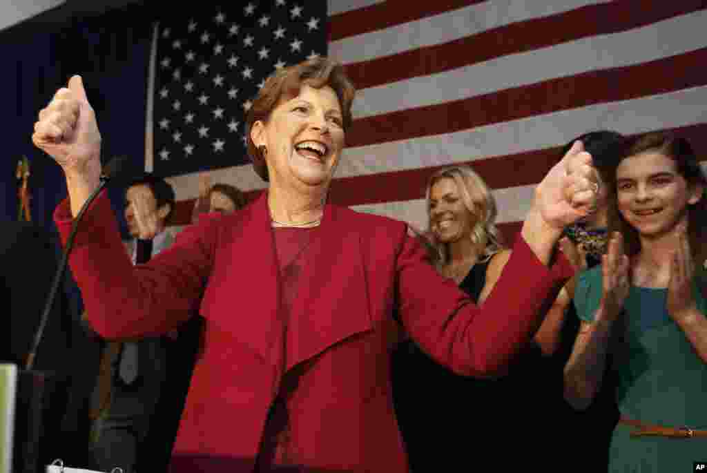 In New Hampshire, Democratic Senator Jeanne Shaheen beats Republican Scott Brown to win a second term. She celebrates in Manchester, Nov. 4, 2014.