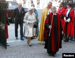 FILE - Queen Elizabeth arrives with Prince Philip at Westminster Abbey to celebrate the 60th anniversary of her coronation in London, June 4, 2013.