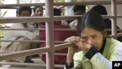 Eighteen year old Montagnard hill-tribe woman from Vietnam, Rmah H'Bin, takes a break during an orientation course run by the International Organisation for Migration in Pnom Penh, file photo. 