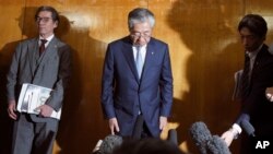 International Olympics Committee member and head of the Japanese Olympic Committee Tsunekazu Takeda bows as he speaks after a JOC executive board meeting in Tokyo Tuesday, March 19, 2019. Takeda is resigning amid a bribery scandal. (AP Photo/Eugene Hoshiko)