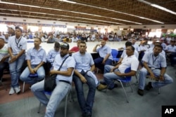 Workers of General Motors listen during a meeting with government officials at the company's plant in Valencia, Venezuela, April 20, 2017.