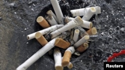 Cigarette butts are seen in an ashtray in Los Angeles, California, May 31, 2012. 