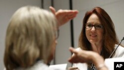 Republican Washington Secretary of State Kim Wyman, listens to a question during a convention of state secretaries of state, July 14, 2018, in Philadelphia. Wyman told her peers how her state is using its National Guard to help test and shore up cybersecurity for elections.