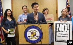 FILE - Hawaii Attorney General Douglas Chin speaks at a news conference about President Donald Donald Trump's travel ban, June 30, 2017 in Honolulu.