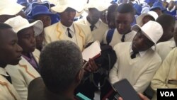 Njube High School students speaking with a provincial education official in Bulawayo.