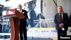 William Lacy Swing, IOM director-general, addresses a news conference next to Filippo Grandi, High Commissioner for Refugees, after the morning session of the Pledging Conference for Rohingya Refugee Crisis in Bangladesh at the UN in Geneva, Oct. 23, 2017.