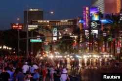 Tourists enjoy the Las Vegas Strip as they visit Las Vegas, Nevada, Aug. 27, 2018.