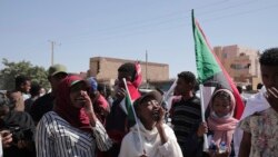 People chant slogans during a protest to denounce the October military coup, in Khartoum, Sudan, Dec. 30, 2021. The October military takeover upended a fragile planned transition to democratic rule and led to relentless street demonstrations across Sudan.