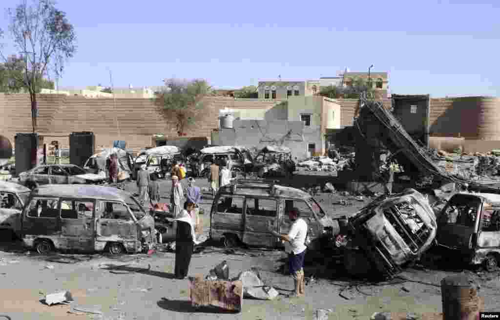 Destroyed vehicles are seen at a gas station after it was hit by an airstrike in Yemen&#39;s northwestern city of Saada, April 16, 2015.