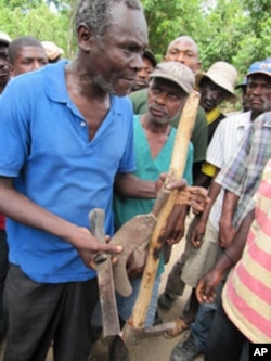 Many farmers in Haiti use rudimentary tools.
