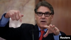FILE - U.S. Secretary of Energy Rick Perry gestures during a news conference in New Delhi, India, April 17, 2018. 