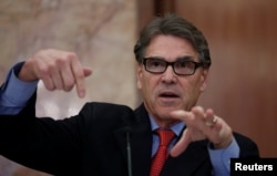 FILE - U.S. Secretary of Energy Rick Perry gestures during a news conference in New Delhi, India, April 17, 2018.