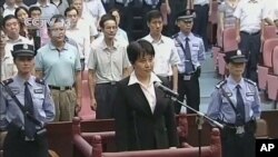 China Death Sentence: FILE - Gu Kailai, center in front, the wife of disgraced politician Bo Xilai, listens to the verdict during her trial at Hefei Intermediate People's Court in the eastern Chinese city of Hefei Monday, Aug. 20, 2012. Gu received a suspended death sentence.