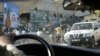 FILE - A United Nation's car drives through the streets of Freetown, Sierra Leone, April 1, 2006.