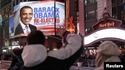 People celebrate in Times Square after Barack Obama was projected to win the U.S presidential election in New York November 6, 2012. 