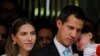 Presiden Sementara Venezuela, Juan Guaido, didampingi istrinya, Fabiana Rosales dan putrinya yang berusia 20 bulan, Miranda, mendengarkan pertanyaan wartawan saat konferensi pers di luar apartemen mereka, di Caracas, Venezuela, Kamis, 31 Januari 2019.
