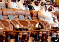 United Arab Emirates Prime Minister Sheikh Mohammad bin Rashed, right, and Ibrahim al-Assaf, Saudi State Minister, attend the opening of the Future Investment Initiative conference, in Riyadh, Oct. 23, 2018.