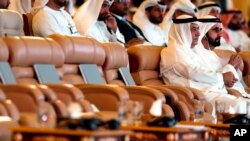 United Arab Emirates Prime Minister Sheikh Mohammad bin Rashed, right, and Ibrahim al-Assaf, Saudi State Minister, attend the opening of the Future Investment Initiative conference, in Riyadh, Oct. 23, 2018.