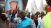 FILE - Felix Tshisekedi, leader of the Democratic Republic of Congo's opposition alliance known as the Rassemblement de l’opposition Congolaise, gestures to his supporters in the Limete Municipality of the DRC's capital Kinshasa, April 24, 2017. 