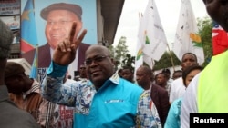 FILE - Felix Tshisekedi, leader of the Democratic Republic of Congo's opposition alliance known as the Rassemblement de l’opposition Congolaise, gestures to his supporters in the Limete Municipality of the DRC's capital Kinshasa, April 24, 2017. 