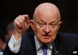 FILE - Former National Intelligence Director James Clapper testifies on Capitol Hill in Washington, before the Senate Judiciary subcommittee on crime and terrorism, May 8, 2017.