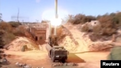 A still image taken from a video footage and released by Russia's Defence Ministry on November 15, 2016, shows Russian Bastion coastal missile launchers launching Oniks missiles at an unknown location in Syria. 