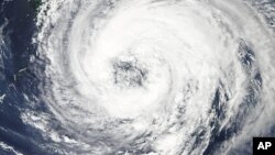 NASA's Aqua satellite captures this image of tropical Storm Talas over the western Pacific Ocean, September 1, 2011, as storm clouds reaches the southern shores of Japan.