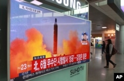 FILE - A TV screen shows a file image of a missile launch conducted by North Korea in a local news program, at Seoul Railway Station in Seoul, South Korea, Oct. 16, 2016.