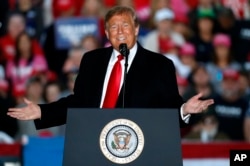 FILE - President Donald Trump speaks during a rally at Southern Illinois Airport in Murphysboro, Ill.