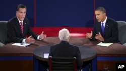 Republican presidential nominee Mitt Romney and President Obama answer a question during the third presidential debate focused mostly on the Middle East, October 22