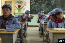 四川北川红军小学的学生穿着红军服装（2015年1月21日）