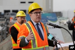 FILE - Andrew Wheeler, the U.S. Environmental Protection Agency's Acting Administrator, talks to reporters after touring the Georgetown Wet Weather Treatment Station in Seattle, Oct. 3, 2018.