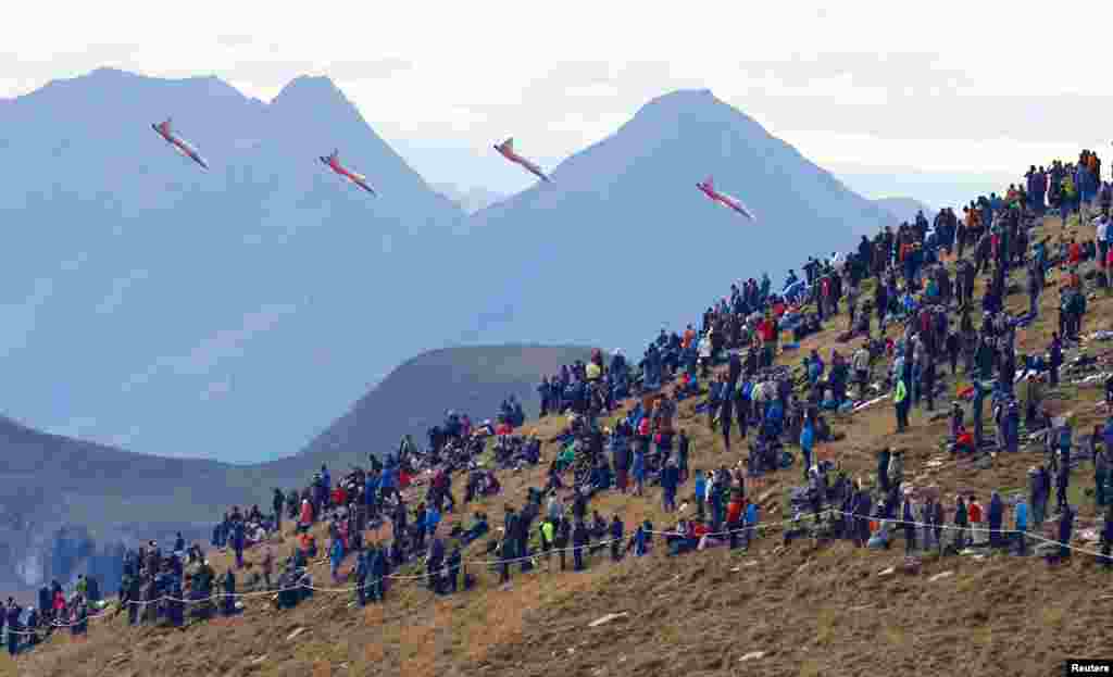 Pilots of the Patrouille Suisse fly their Northrop F-5E Tiger II fighter jets during a flight demonstration of the Swiss Air Force over the Axalp in the Bernese Oberland, Switzerland, Oct. 20, 2021.