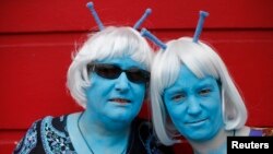 FILE - Science fiction enthusiasts Anne Clothier (L) and Gail Tomlinson, dressed as Andorians from Star Trek, pose for a photograph outside the 12th annual Sci-Fi London festival in east London, April 28, 2013. 