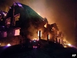 This image from video provided by the Hutton Incident Team shows the historic main Sperry Chalet building engulfed in flames in Glacier National Park, Mont., Aug. 31, 2017. Glacier National Park's historic Sperry Chalet was lost to the Sprague Fire overnight.