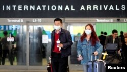 FILE - Passengers leave LAX after arriving from Shanghai, China, January 26, 2020. (REUTERS/Ringo Chiu)