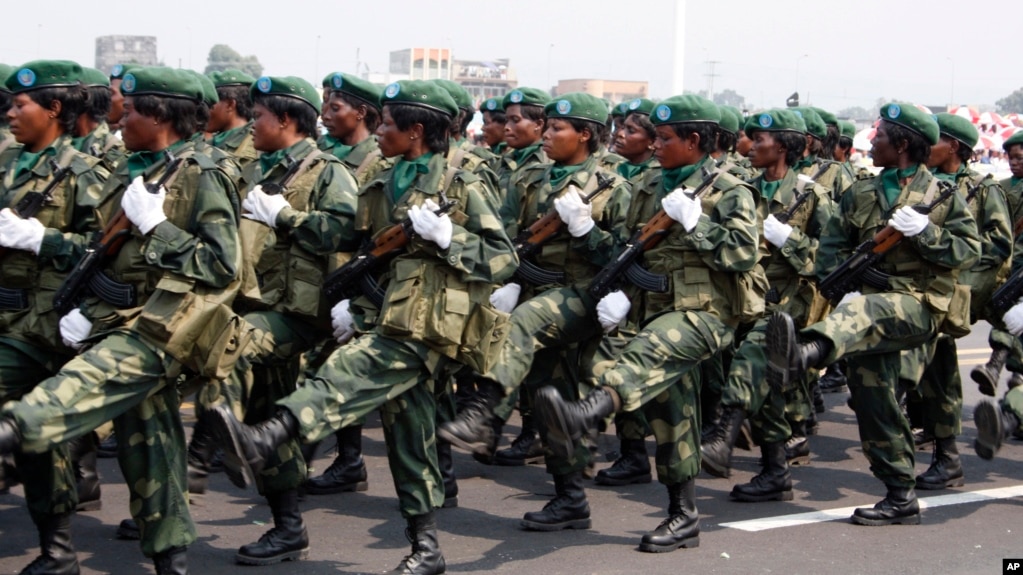 FILE - Female soldiers march in a parade as part of celebrations of Congo's 50th anniversary of independence, in Kinshasa, Congo Wednesday, June 30, 2010. 