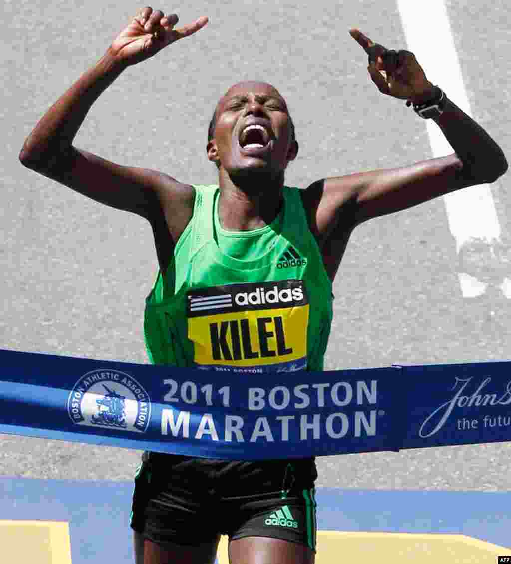 April 18: Caroline Kilel of Kenya reacts as she hits the tape at the finish line to win the women's division of the 115th Boston Marathon in Boston. (AP Photo/Charles Krupa)