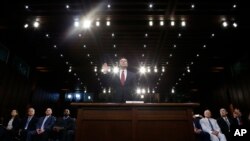 Former FBI Director James Comey is sworn in during a Senate Intelligence Committee hearing on Capitol Hill, Thursday, June 8, 2017, in Washington. (AP Photo/Alex Brandon)