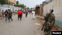 FILE - A soldier patrols the streets after a grenade attack of Burundi's capital Bujumbura, Feb. 3, 2016. The East African Community (EAC), meeting in Arusha, Tanzania Wednesday named the 77-year old Mkapa to hopefully breed new life into talks.