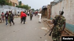 FILE - A soldier patrols a street after a grenade attack in Burundi's capital Bujumbura, Feb. 3, 2016.