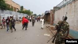 A soldier patrols the streets after a grenade attack of Burundi's capital Bujumbura, Feb. 3, 2016. European Union foreign ministers say they are prepared to increase economic sanctions on Burundi which has been in a political crisis since July when President Pierre Nkurunziza won a third term.