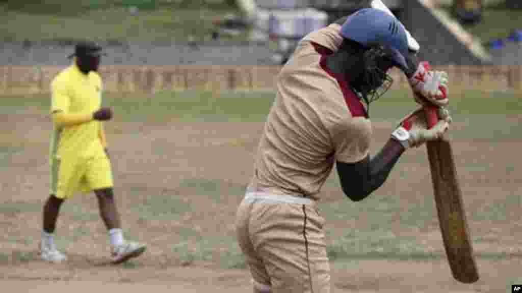 Men practice cricket at Tafawa Balewa Square in Lagos.